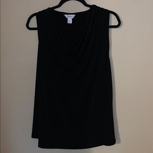 Sleeveless blouse with dropped neckline.